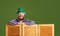 Happy Patrick`s Day. Funny fat bearded man in a green hat is laughing on a green background.