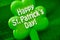 Happy Patrick`s day inscription on green maple leaf on green background