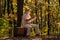 Happy pensioner relax on autumn nature. Retirement travel and hobbies. Ecology. Mature man hold yellow leaves