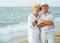 happy pensioners woman and man on the beach