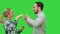 Happy people casual dressed enjoying dancing together on a Green Screen, Chroma Key.