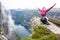 Happy people relax in cliff during trip Norway. hiking route