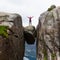 Happy people relax in cliff during trip Norway. hiking route