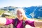 Happy people relax in cliff during trip Norway. Trolltunga hiking route