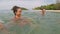 Happy people swimming in sea action camera water pov of young friends group together on beach