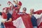 happy peruvian stadium soccer,futbol, fans commemorating victory, with the flag of peru swinging ,face painting- may 2018