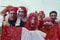 happy peruvian stadium soccer,futbol, fans commemorating victory, with the flag of peru swinging ,face painting- may 2018