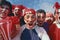 happy peruvian stadium soccer,futbol, fans commemorating victory, with the flag of peru swinging ,face painting- may 2018