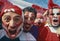 happy peruvian stadium soccer,futbol, fans commemorating victory, with the flag of peru swinging ,face painting- may 2018