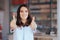 Happy Pharmacist Woman Holding Thumbs Up Greeting Clients