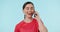 Happy, phone call and woman in studio networking, contact and laughing against blue background. Smartphone, face and