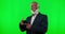 Happy, phone and face of a black man on a green screen isolated on a studio background. Excited, pointing and portrait