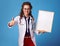 Happy physician woman showing thumbs up and and blank board