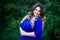 Happy plus size fashion model in blue dress outdoors, happiness beauty woman with professional makeup and hairstyle