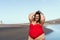 Happy plus size woman posing on the beach - Curvy overweight model having fun during vacation in tropical destination