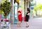 Happy plus size women shopping, talking on the street