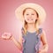 Happy, portrait and girl with a donut or child with sugar, dessert and sweet craving on pink background in studio. Face