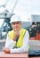 Happy portrait, logistics and shipping man or manager smile on port with container, cargo or construction site