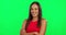 Happy, portrait and woman with arms crossed on green screen with confident, pride or laughing girl and student. Face