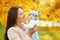 happy portraits of mom and baby in autumn park