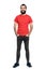 Happy positive friendly bearded man in red t-shirt and tight jeans laughing at camera