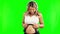 Happy, pregnant woman or headphones on belly on green screen for growth or baby development. Pregnancy music, relax or