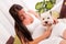 Happy pregnant woman with west highland white terrier relaxing