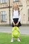 Happy preschool girl with backpack in school yard. back to school. child in uniform carry school bag. concept of