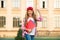 Happy preschool girl with folder in school yard. back to school. hardworking child with book. concept of education. time