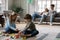 Happy preschool siblings enjoying playtime while parents resting.