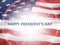 Happy president`s day - poster with the flying flag of the United States of America