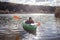 Happy preteen girl kayaking on river, paddle in the hand, summer camp activity, extreme sport