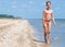 Happy Pretty beautiful girl running on beach