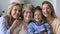 Happy pretty girl kid, young, mature, elderly women standing close