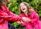 Happy pretty little girl playing with her mother