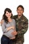 Happy proud military soldier hugging pregnant wife