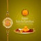 Happy raksha bandhan celebration greeting card with creative realistic rakhi and pooja thali with kumkum, rice