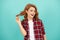 happy redhead woman with curly hair in checkered casual shirt, style