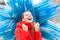 Happy redhead woman in red coat pumping fists in Murano