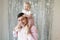 Happy relationship of handsome dad and cute daughter having fun at home. Portrait of father and toddler girl celebrate and enjoy