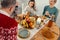 Happy relatives are sitting around table