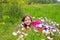 Happy relaxed kid girl on a spring flowers meadow