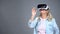 Happy retiree female wearing VR headset, modern technologies, innovations