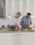 Happy retirees couple cooking healthy breakfast together