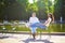 Happy romantic couple in Paris, sitting on traditional green metal chairs in Tuileries garden