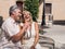 Happy romantic mature couple laughing at a good joke with ice cream