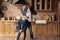 Happy romantic young couple dancing in renovated kitchen.