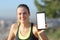 Happy runner showing blank smart phone screen