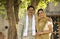 Happy rural Indian farmer with his wife at village