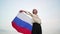 A happy Russian woman whirls with the Russian flag. Independence Day of the Russian Federation